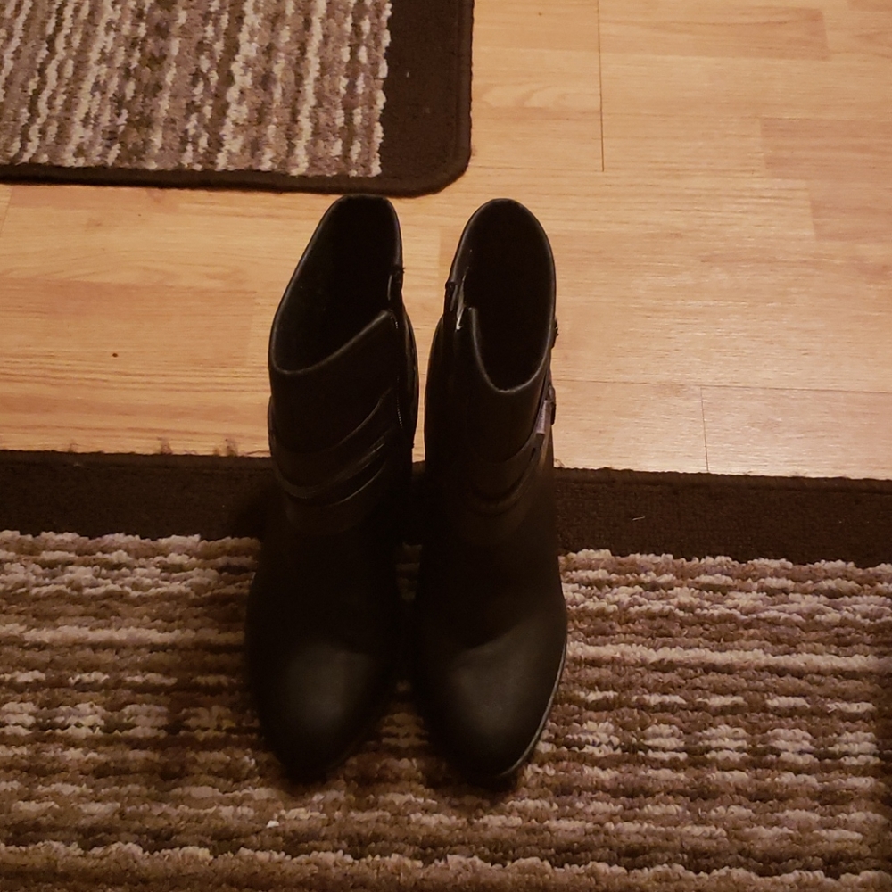 Short heel boots with a buckle heal design.